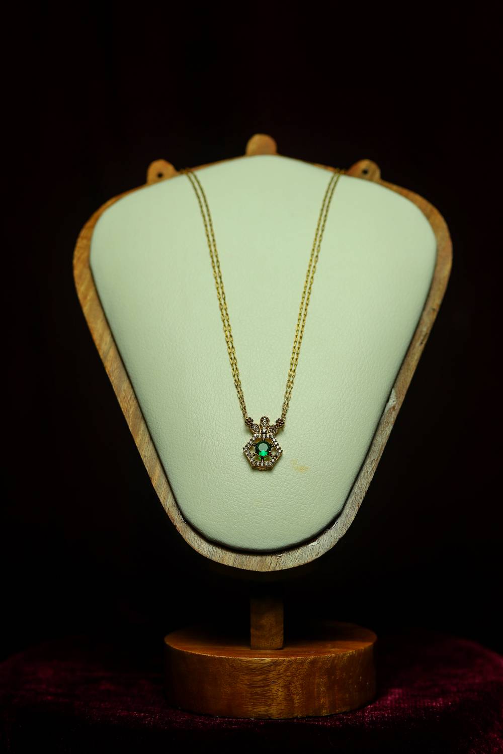 Double-Strand Gold Cable Chain paired with a Regal Crown-Top Hexagonal Emerald Pendant