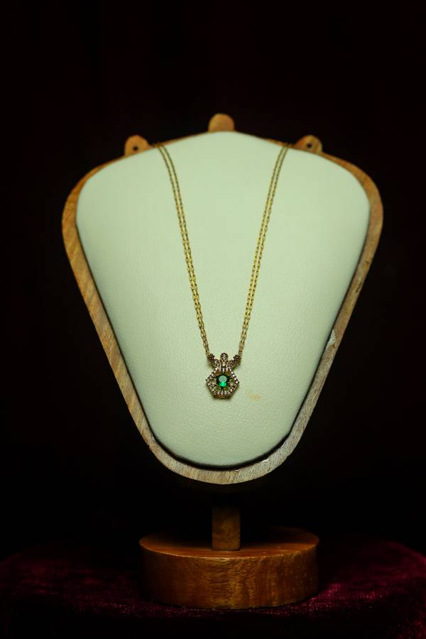 Double-Strand Gold Cable Chain paired with a Regal Crown-Top Hexagonal Emerald Pendant