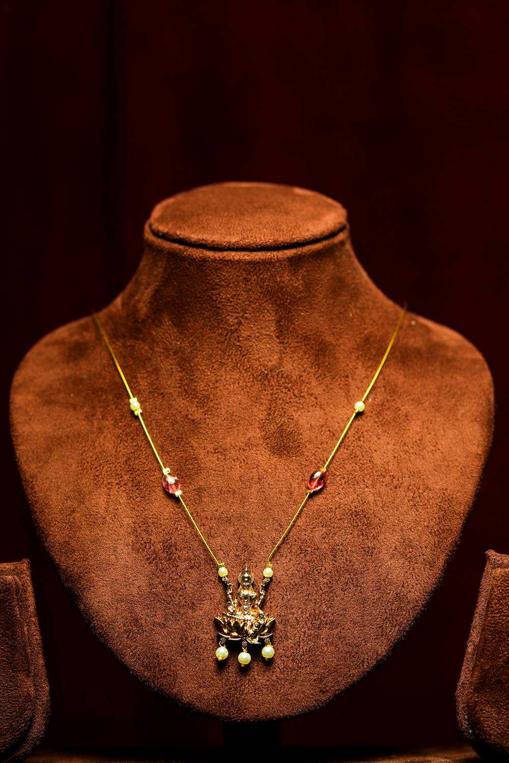 Polished Gold Lakshmi Lotus Pendant Invisible Chain Necklace