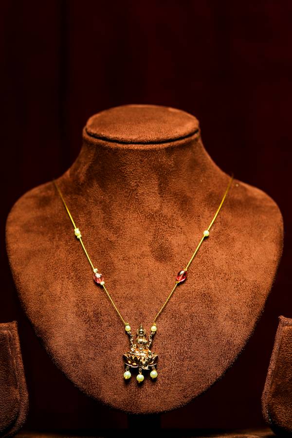Polished Gold Lakshmi Lotus Pendant Invisible Chain Necklace