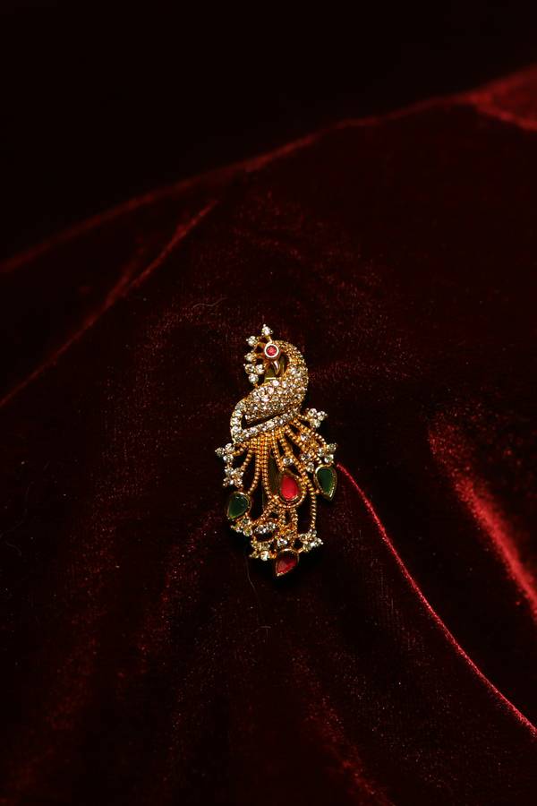 Heritage Gold-Plated Peacock Saree Pin with Teardrop Kemp Stones