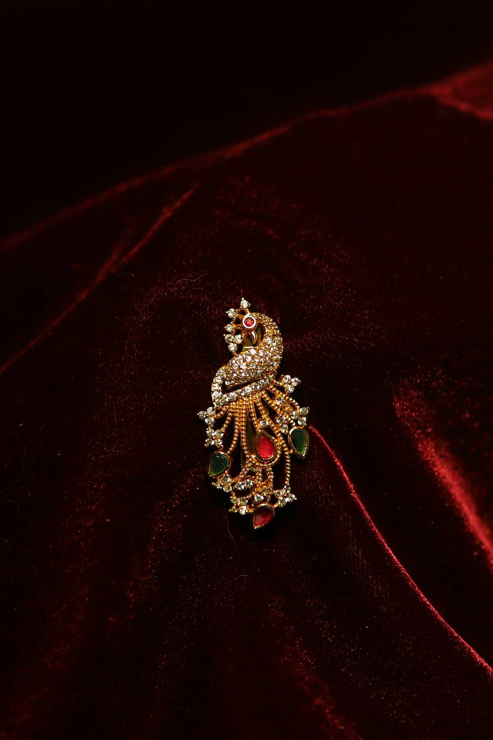 Heritage Gold-Plated Peacock Saree Pin with Teardrop Kemp Stones