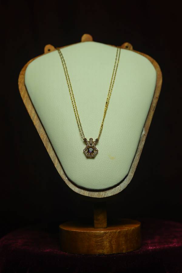  Double-Strand Gold Cable Chain and Crown-Top Hexagonal paired with a deep, regal amethyst-purple focal stone.