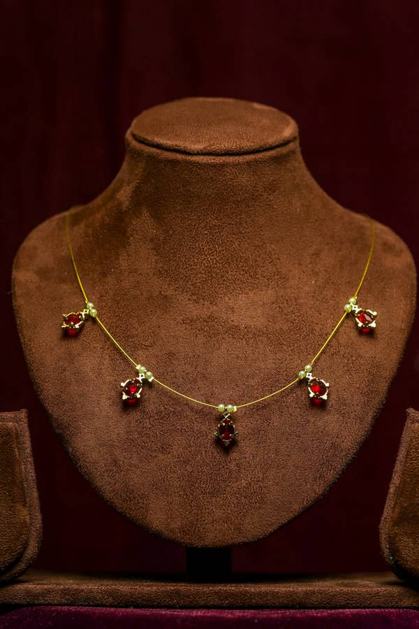  Elegant Invisible Chain Necklace with Red Colour Teardrop Pendants